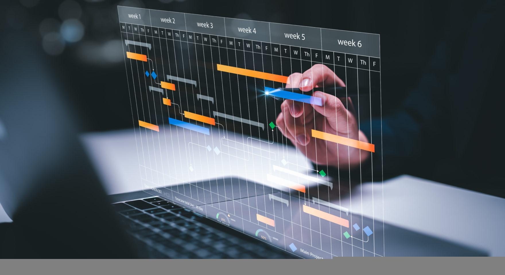 Business team planning project on laptop