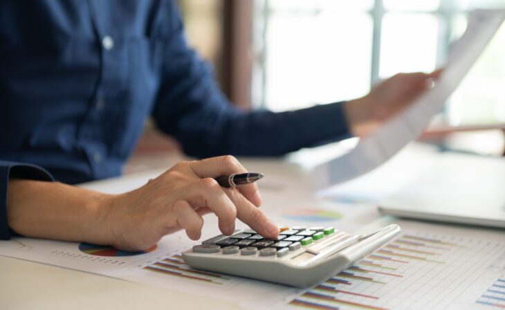 Finance manager calculating budget and capital plan