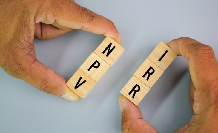 wooden cube with letters NPV and IRR or net present value and internal rate of return