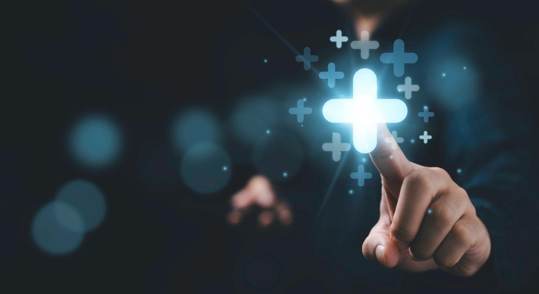 Businessman touching plus sign symbolizing profit growth