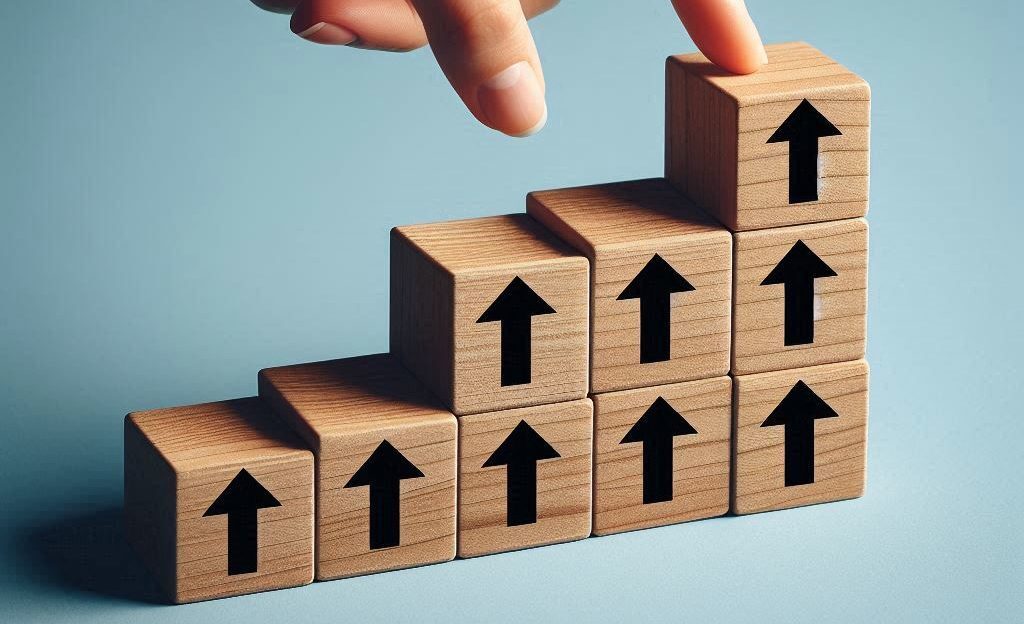 Wooden blocks with upward arrows on light blue background