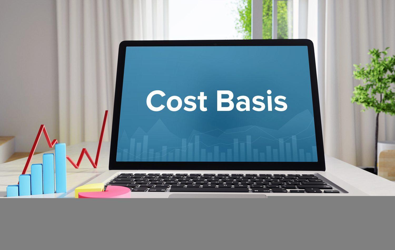Cost Basis – Statistics/Business. Laptop in the office with term on the display. Finance/Economics.