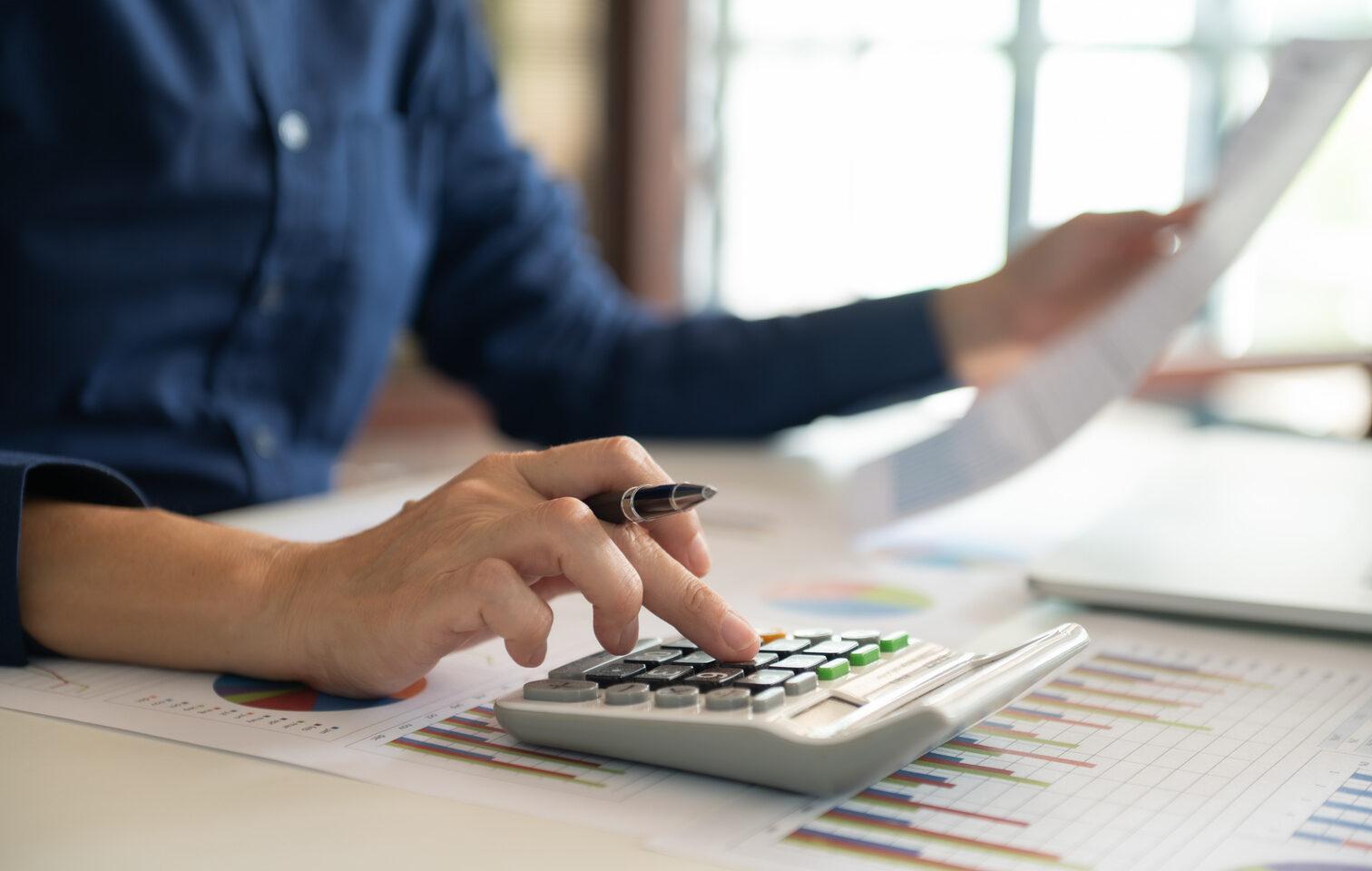 Finance manager calculating budget and capital plan