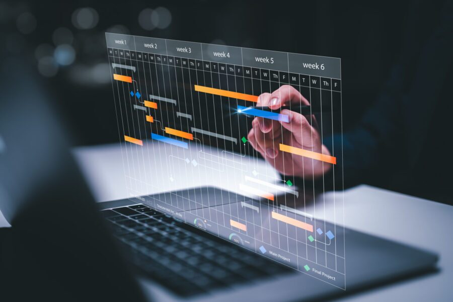 M&A planning and Implementation, Business people use laptop computers to manage work projects and update tasks. Work progress, efficient scheduling.Business Data Management scheduling